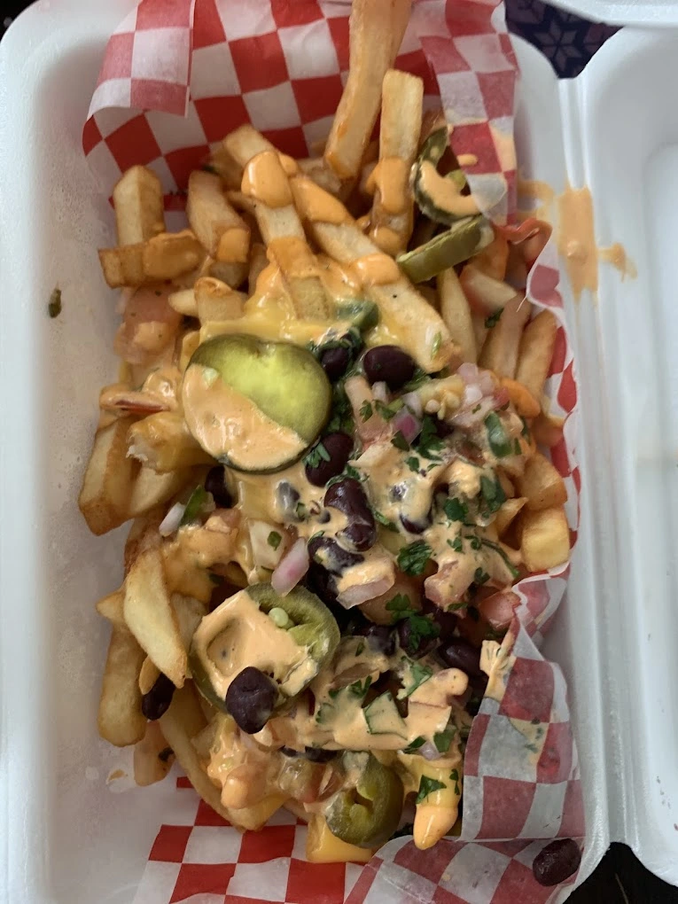Loaded taco fries with queso sauce and pico de gallo at Don Taco Calgary