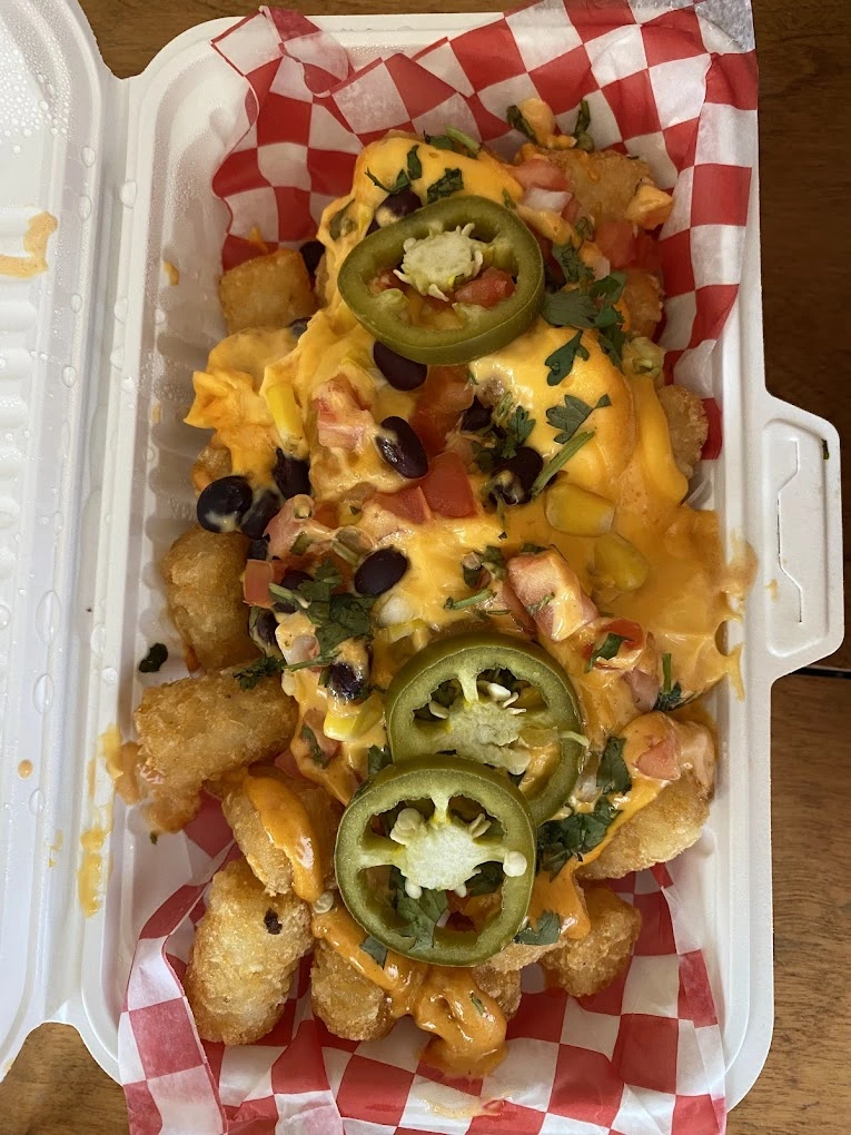 Taco tater tots with queso, black beans and jalapenos at Don Taco Calgary