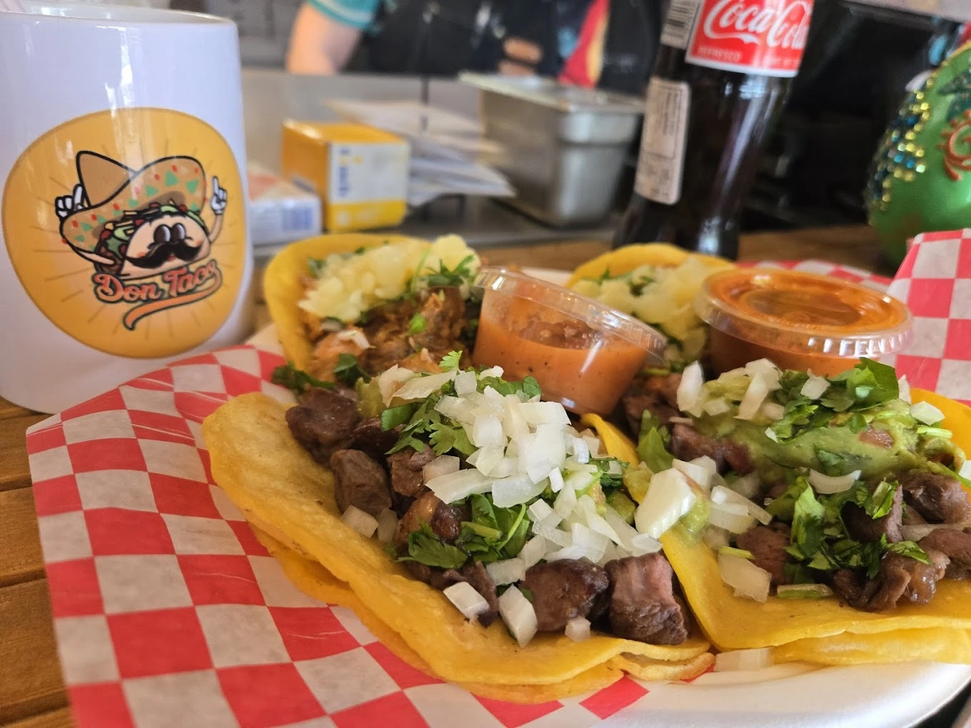 Beef and al pastor tacos with guacamole and Mexican Coca-Cola at Don Taco Calgary
