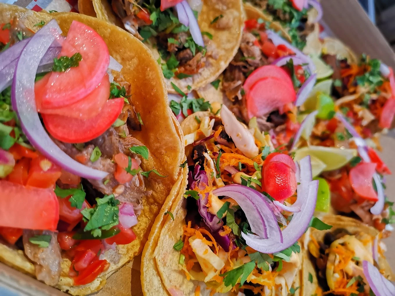 Mix and match street tacos platter with pickled radish and cilantro at Don Taco Calgary
