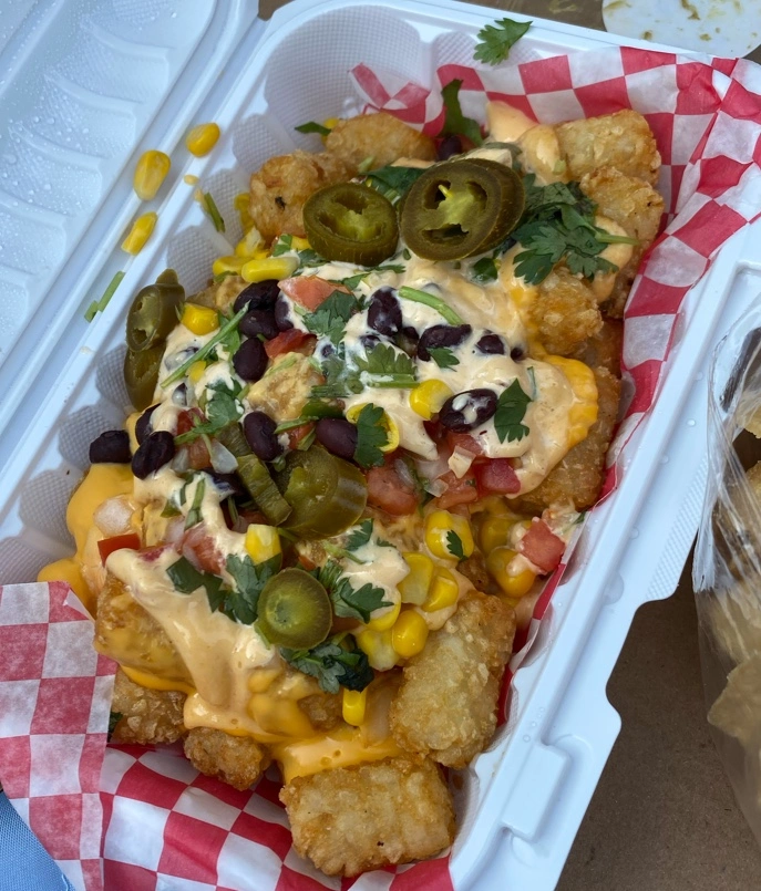 Taco tater tots loaded with queso, black beans, corn and jalapenos at Don Taco Calgary